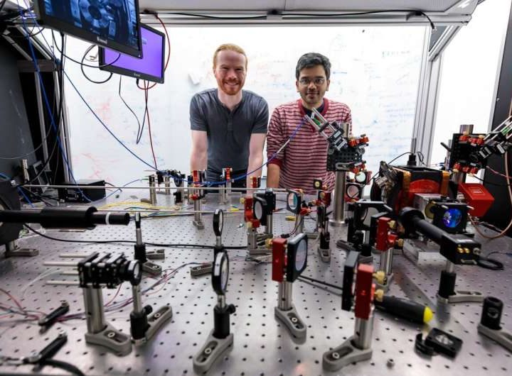 Combining trapped atoms and photonics for new quantum devices