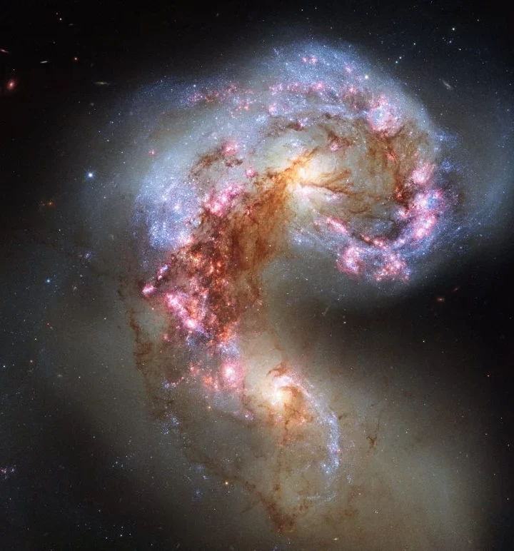 How Cosmic Collisions Created the Universe’s Biggest Galaxies